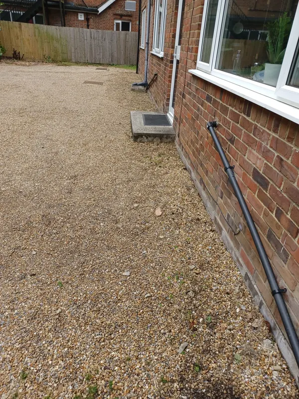 Gravel courtyard weeded and raked