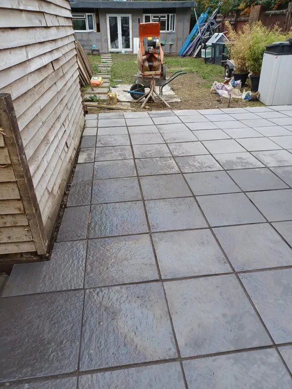Patio finished neatly up to the garden shed